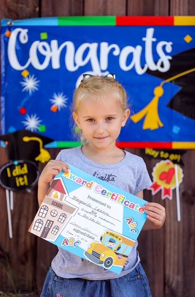 Young learner holding an award certificate